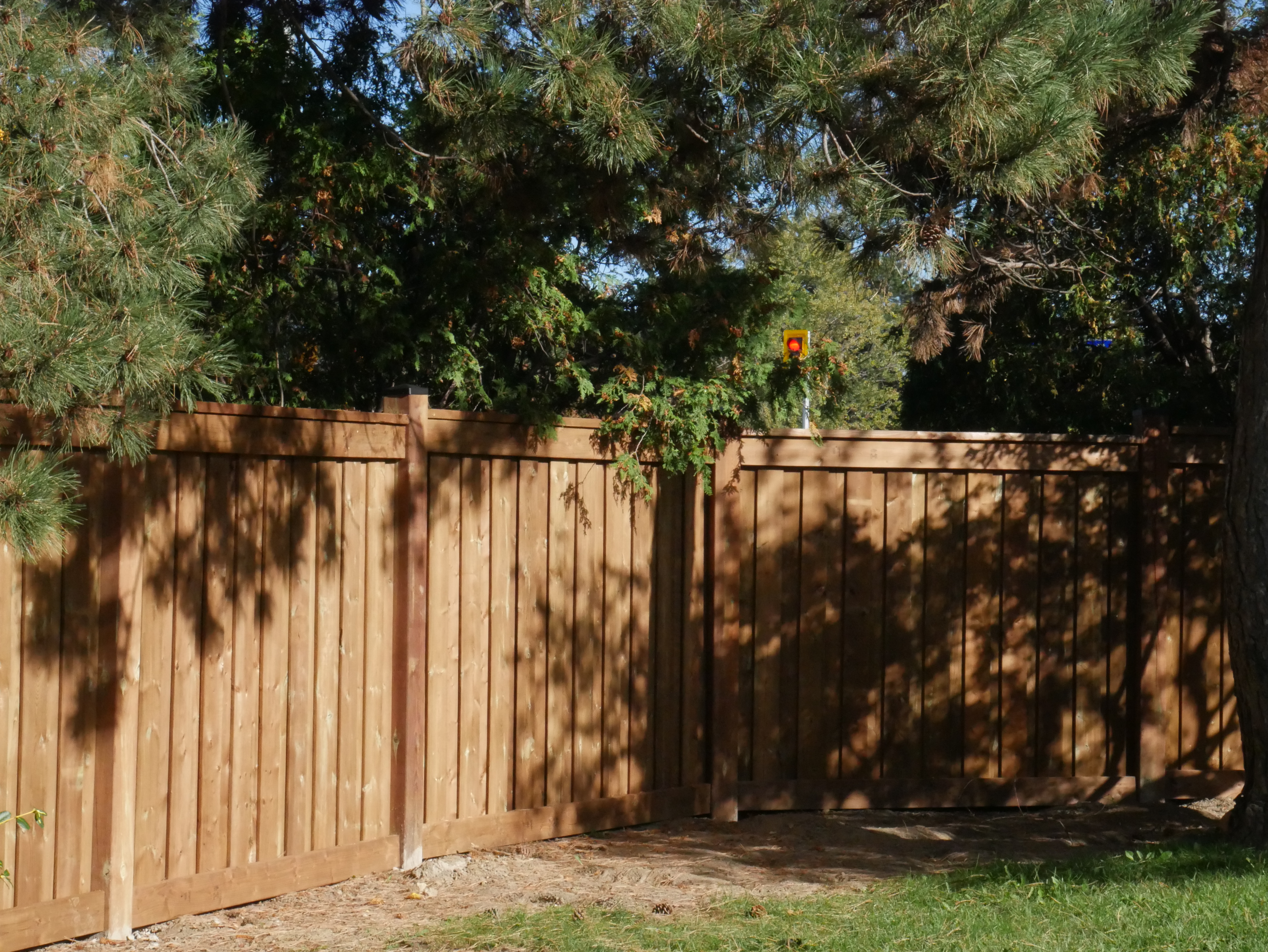 Finished wood privacy fence and gate installation in Toronto